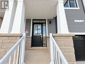 Haldimand townhouse for rent - The entrance to a home with a black door and a sign that reads "73".