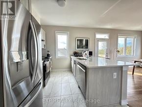 Ottawa townhouse for rent - A modern kitchen with stainless steel appliances and a large island.