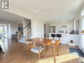 Ottawa townhouse for rent - A dining room with a wooden table and chairs.
