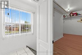 Toronto (Humber Summit) apartment for rent - A room with a sliding door and a window with blinds.
