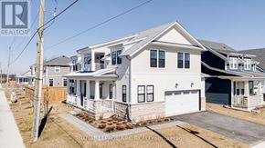 Fort Erie (Crystal Beach) apartment for rent - A white house with a garage is for sale.