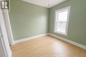 Barrie (City Centre) apartment for rent - A room with a window and wooden flooring.