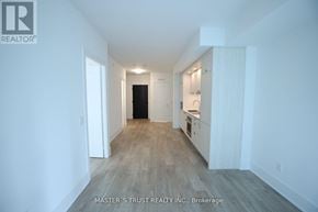 Toronto (Waterfront Communities) condo for rent - A white room with a door and a cabinet.