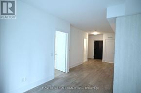 Toronto (Waterfront Communities) condo for rent - A white room with a door and a window.
