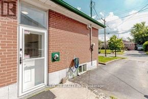 Halton Hills (Georgetown) apartment for rent - A brick building with a white door and a sign that says Intercity Realty Inc. Brokerage.