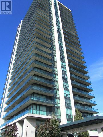 Brampton (Downtown Brampton) condo for rent - A tall residential building with balconies on each floor.