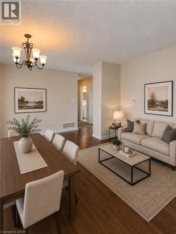 Hamilton apartment for rent - A well-lit living room with a dining table and a couch.