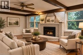 Hamilton apartment for rent - A living room with a fireplace and a ceiling fan.