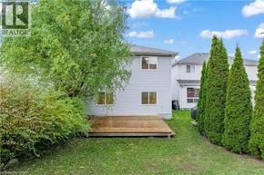 Waterloo apartment for rent - A white house with a wooden deck in the front yard.