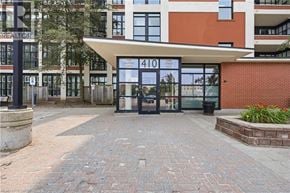 Kitchener condo for rent - The entrance to a building with a sign that reads "410" is shown.