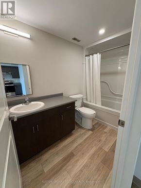 London South (South J) condo for rent - A bathroom with a sink, toilet, and bathtub.