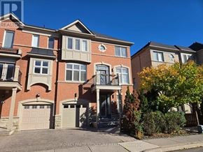 Vaughan (East Woodbridge) townhouse for rent - A large, multi-story residential building with a brick facade and multiple balconies.