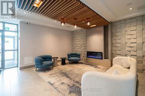 Barrie (Little Lake) condo for rent - A modern living room with a wooden ceiling and a stone wall.