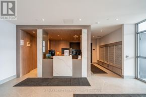Barrie (Little Lake) condo for rent - A reception area with a desk and a large window.