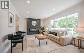 Brantford apartment for rent - A living room with a fireplace and a couch.