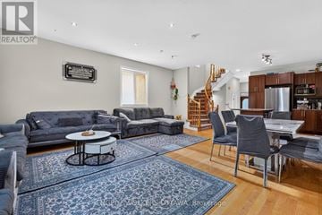 Ottawa townhouse for rent - A living room with a grey couch and a coffee table.
