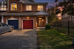 Ottawa townhouse for rent - A house with a car parked in front of it.