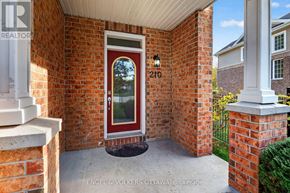 Ottawa townhouse for rent - A red door with the number 210 on it is the main focus of this image.
