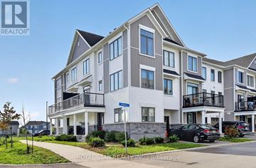 Ottawa townhouse for rent - A modern apartment building with a car parked in front.