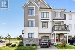 Ottawa townhouse for rent - A two-story building with a balcony on the second floor.