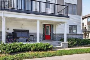 Ottawa townhouse for rent - A house with a red door and a balcony.