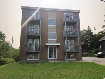 Halifax apartment for rent - A building with a balcony on the second floor.