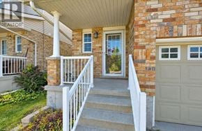 Kitchener apartment for rent - A house with a white porch and a brick wall.