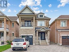 Vaughan (Vellore Village) apartment for rent - A white car is parked in front of a two-story house.