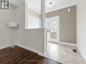 Vaughan (Vellore Village) apartment for rent - A well-lit room with a wooden floor and a white door.