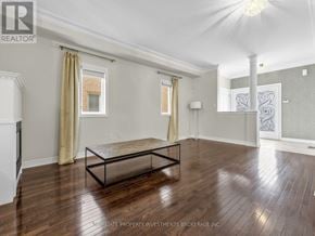 Vaughan (Vellore Village) apartment for rent - A spacious room with a wooden floor and a large mirror on the wall.