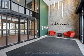 Lincoln (Lincoln-Jordan/Vineland) condo for rent - A brokerage office with a green wall and red chairs.