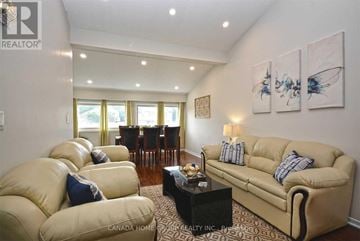 Mississauga (Erin Mills) apartment for rent - A living room with a tan couch and a coffee table.