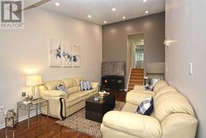 Mississauga (Erin Mills) apartment for rent - A living room with a beige couch and a coffee table.