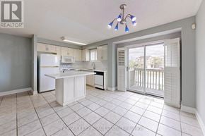 Vaughan (Maple) townhouse for rent - A kitchen with white appliances and a white island.