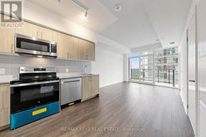 Toronto (Humber Heights) condo for rent - A modern kitchen with wooden cabinets and a blue oven.