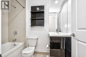 Toronto (Mimico) condo for rent - A bathroom with a toilet, sink, and shower.