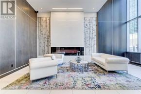 Toronto (Lansing-Westgate) condo for rent - A living room with a rug and two white couches.