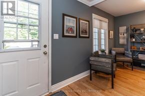 Huntsville townhouse for rent - A room with a white door and a grey wall with pictures hanging on it.