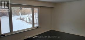 Pickering (Rosebank) apartment for rent - A room with a window showing a snowy landscape outside.