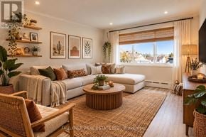 Ottawa condo for rent - A well-lit living room with a large sofa, a coffee table, and a TV.