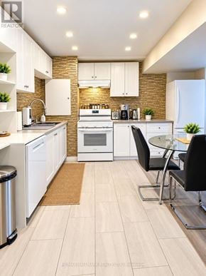 Milton (Wi Willmott) apartment for rent - A modern kitchen with white appliances and a glass table.