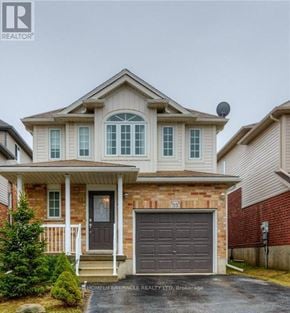 Kitchener apartment for rent - A two-story house with a garage is for sale.
