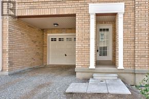 Oakville (Wm Westmount) townhouse for rent - A brick house with a white door and a window above it.
