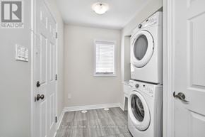 Oakville (Wm Westmount) townhouse for rent - A laundry room with a washer and dryer in it.