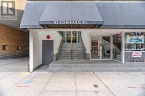 Toronto (Church-Yonge Corridor) condo for rent - The front of a building with a sign that says 82 Lombard St.