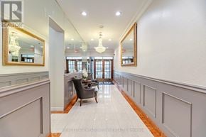 Toronto (Church-Yonge Corridor) condo for rent - A hallway with a chair and a mirror on the wall.