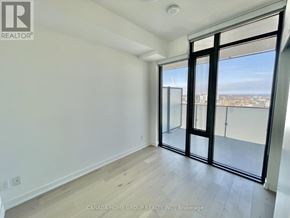Toronto (Church-Yonge Corridor) condo for rent - A room with a sliding glass door leading to a balcony.