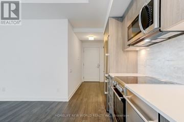 Toronto (Church-Yonge Corridor) condo for rent - A kitchen with a white counter top and stainless steel appliances.
