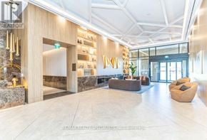 Vaughan (Vaughan Corporate Centre) condo for rent - A spacious lobby with a reception desk and comfortable seating areas.