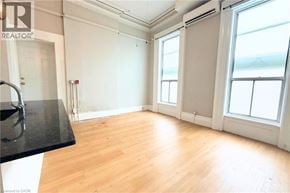 Hamilton apartment for rent - A room with wooden floors and a sink.